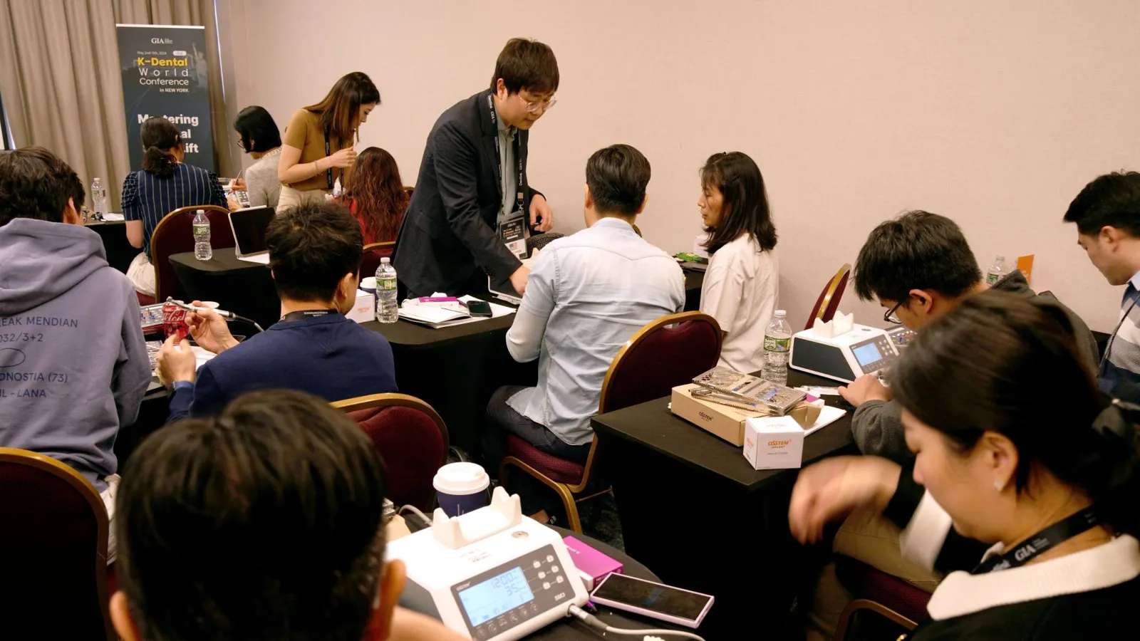 Dentists practicing implant technique at a workshop